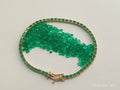 Pulsera Tenis 19cms, 53 esmeraldas naturales, Oro 18k Italiano.